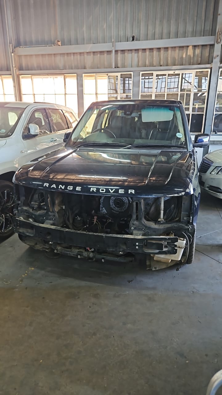 Front-on view of the same Range Rover showing the engine bay with components removed.